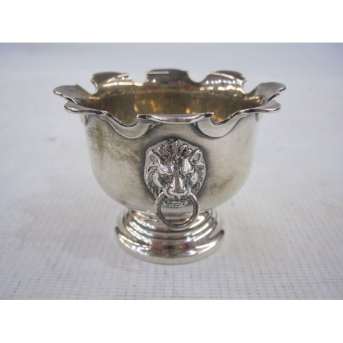 193 - Silver shell-bowl caddy spoon, Sheffield 1942, a silver  miniature urn with scalloped everted rim an... 