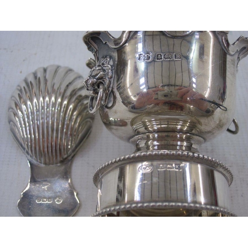 193 - Silver shell-bowl caddy spoon, Sheffield 1942, a silver  miniature urn with scalloped everted rim an... 