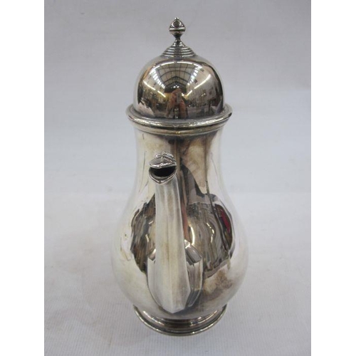 199 - Silver coffee pot with domed cover and beak spout, ebonised handle, Birmingham 1975, gross weight 31... 