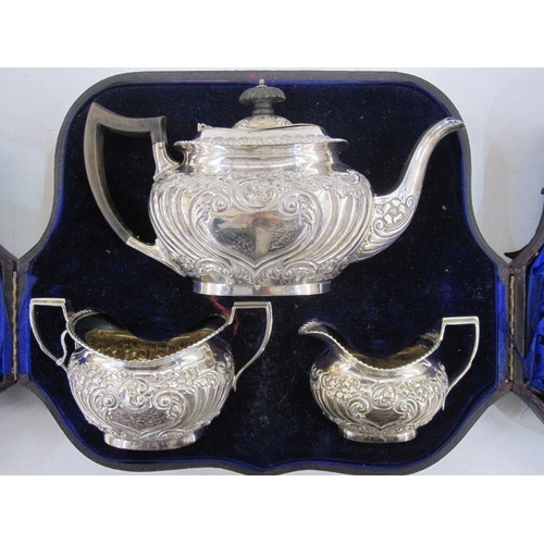 227 - A late Victorian silver three-piece tea service having gadrooned rims, the bodies with repousse scro... 