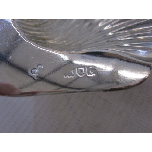 231 - Silver sauceboat with S-scroll handles and on three scroll feet, Birmingham 1948, a silver shell but... 