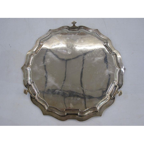 234 - Silver salver by Joseph Gloster Limited, Birmingham 1935 of shaped circular form, on three paw feet,... 