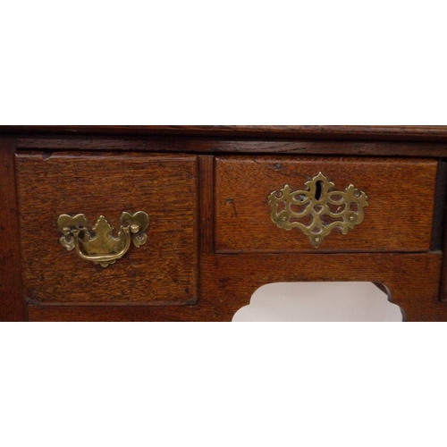 24 - Georgian-style oak lowboy, the rectangular top with moulded edge and rounded front corners, above th... 