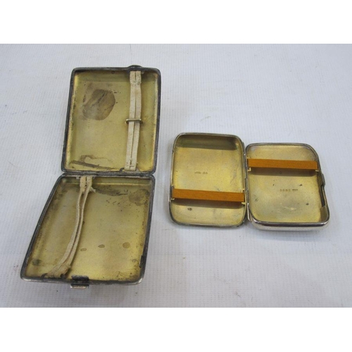 244 - Silver engine-turned cigarette case and a plain silver cigarette case with engraved initials (2)