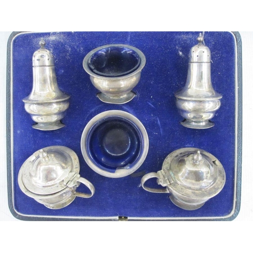 259 - Silver condiments set, Sheffield 1928, comprising a pair of pepperettes, a pair of mustards and a pa... 