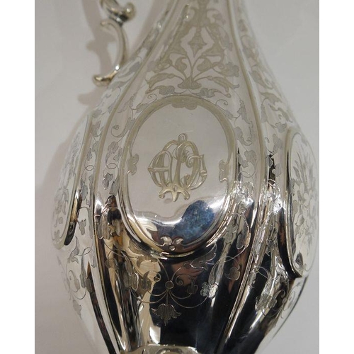 285 - EPNS plated claret jug engraved with vines, a Bacchus mask and engraved initials