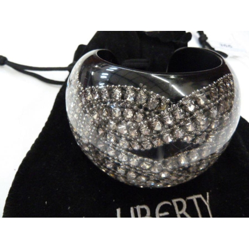 366 - Liberty diamante and perspex cuff bracelet, black with diamante knot design