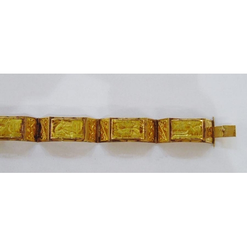 404B - Egyptian-style gold-coloured metal bracelet panelled with relief scenes of sailing boats and camels,... 