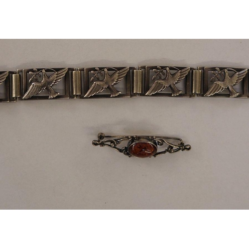 424 - Silver-coloured metal dove of peace panelled bracelet and a silver-coloured metal and amber bar broo... 