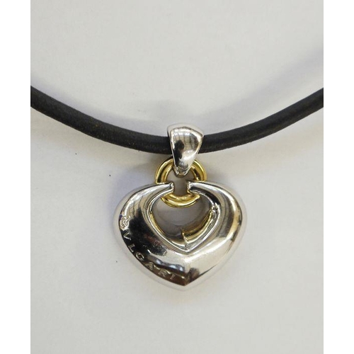 428 - Bulgari 18ct white and yellow gold open heart pendant on leather cord strap, the pendant 23g approx.