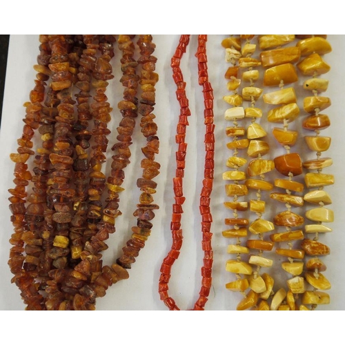 444 - One  rough amber beaded necklace. two other amber necklaces and a coral beaded necklace (4)