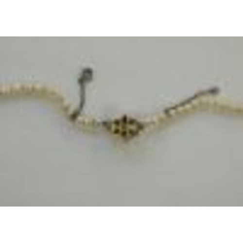 457 - String of graduated cultured pearls with 9ct gold and pearl set flowerhead clasp