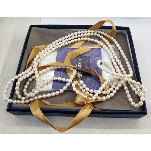 466 - Mikimoto three-strand freshwater pearl necklace having silver flowerhead and pearl set pattern clasp... 