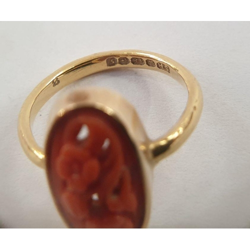 504 - 18ct gold and carved coral ring, oval floral design, openwork and a carved coral ‘hand’ pendant in g... 