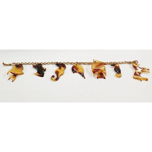 549 - Gold belcher-link bracelet marked 12K and hung with seven assorted tortoiseshell charms including a ... 