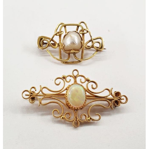 558 - Gold-coloured brooch set with central oval opal cabochon within a scrolling wirework frame, unmarked... 