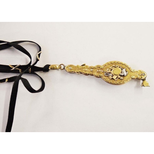 563 - Gold-coloured lorgnette case with panels of three-colour gold decoration depicting musical instrumen... 