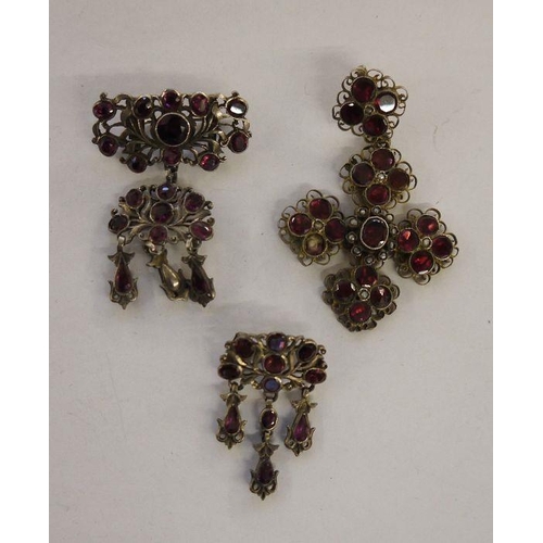 565 - Continental gilded white metal cross pendant set with garnets, paste and seedpearls, with French gua... 