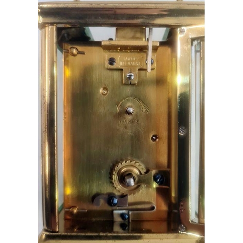 72 - Brass and five-sided glass carriage clock in leather carry case, with Roman numerals to the dial, 11... 