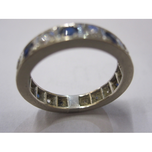 488 - 18ct white gold, sapphire and diamond eternity ring, set with nine brilliant cut diamonds alternatin... 