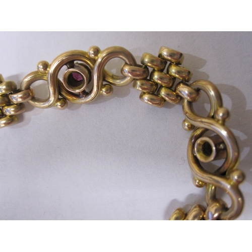 406 - 15ct gold, pearl and ruby-coloured stone ornate bracelet, trellis and scroll links set with three ol... 