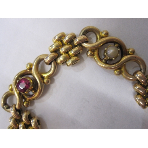 406 - 15ct gold, pearl and ruby-coloured stone ornate bracelet, trellis and scroll links set with three ol... 