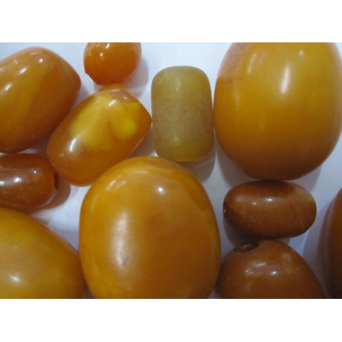 446 - Quantity of yellow, orange, opaque amber beads, graduated and unstrung