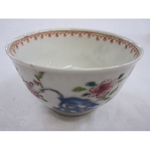 129 - Chinese porcelain teabowl and saucer with polychrome painted figures in a garden and beside window a... 