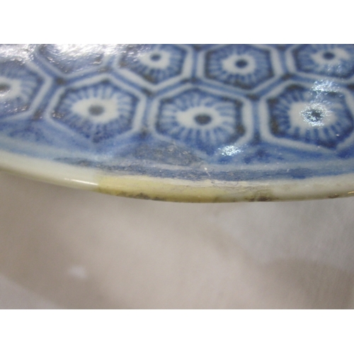 145 - Blue and white porcelain plaque with bird of prey perched on a rocky outcrop, amidst waves, 26cm dia... 