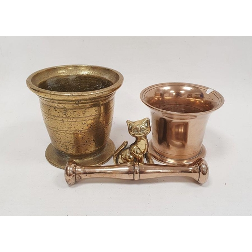 119 - Brass mortar, 13cm high, a copper pestle and mortar and a brass cat ornament (4)