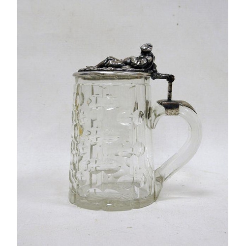 254 - 19th century cut glass tankard with silver coloured metal hinged lid, the thumbpiece in the form of ... 