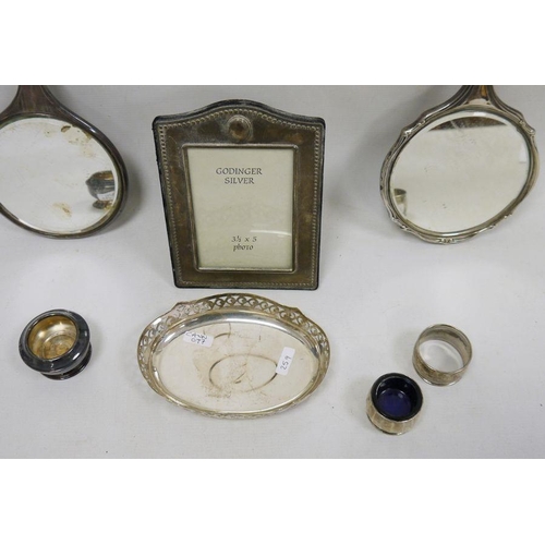 259 - Two silver mounted hand mirrors, silver napkin ring, silver salts and a small quantity of plated war... 