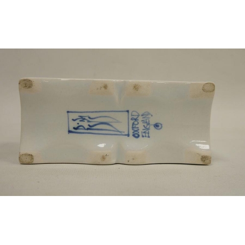 55 - Isis (Oxford) pottery rectangular flower brick, 20th century, blue marks, painted with a tulip patte... 