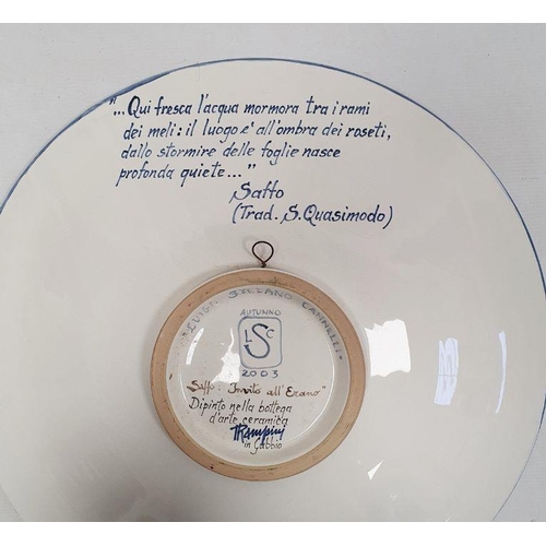 76I - Italian maiolica charger painted by Luigi Steffano Cannelli, 2003, the reverse inscribed with a vers... 