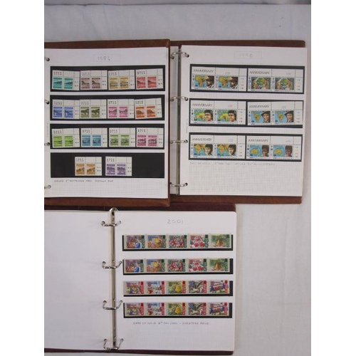 32 - WITHDRAWN  Two boxes of mint Jersey stamps in albums, 8-1980-1990 special stamps year collection (2 ... 