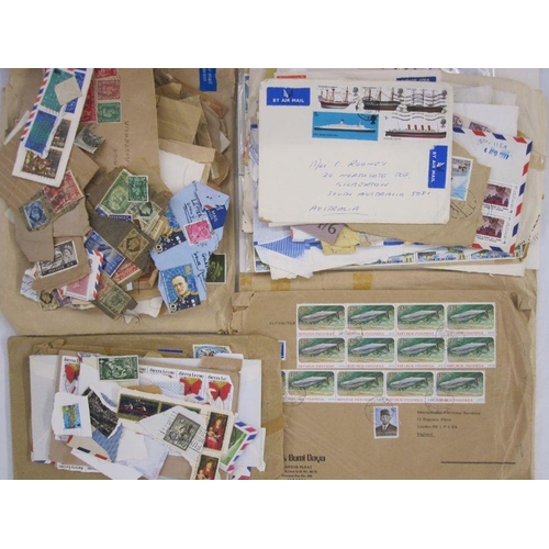 4 - Bag and box of many hundreds of used stamps and Australian year books, appears complete from 1980's ... 