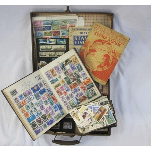 56 - Suitcase with three albums and various loose stamps. First day covers and few on leaves. Mostly mode... 