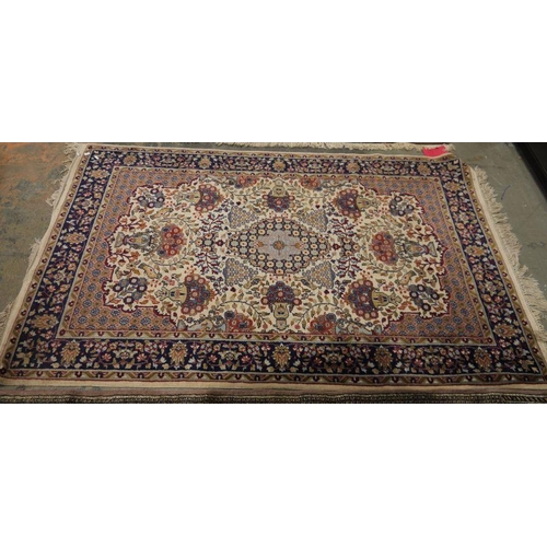 1018 - Persian style ivory rug with central lozenge medallions surrounded by floral and stylised animal des... 