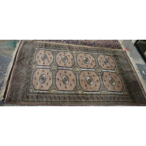 1037 - Eastern mushroom ground rug with two rows of four elephant foot guls and geometric borders 222 x 127... 