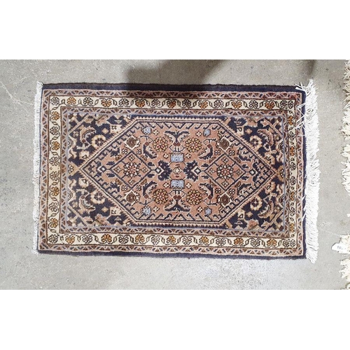 1039 - Modern Persian-style rug with central gold ground medallion on black ground foliate decorated field ... 