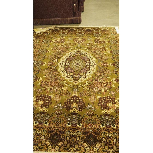 1040 - Modern Persian-style green ground rug with foliate decoration, approx. 350cm x 270cm