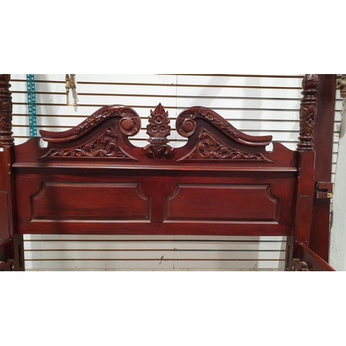 1143 - Modern mahogany four-poster bed with turned and carved posts and heavily carved headboard