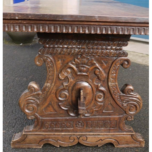 1173 - 17th/18th century Italian walnut trestle table, the rectangular top on carved and shaped end support... 