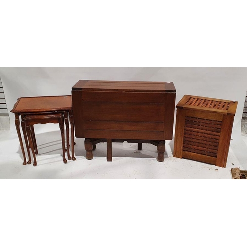 1233 - Oak drop-leaf table, a linen basket and a nest of three coffee tables (3)