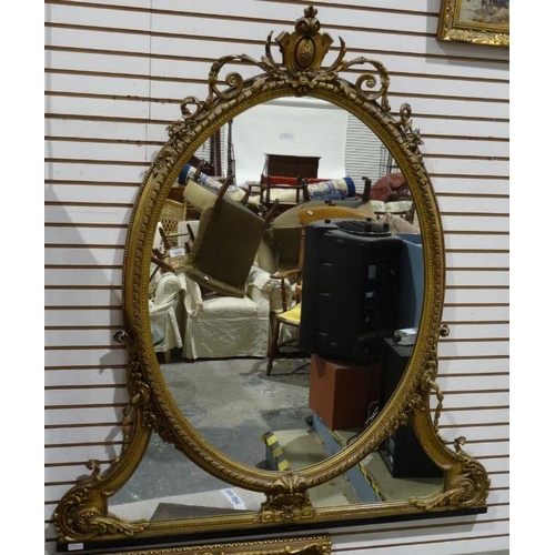 1331 - Regency overmantel wall mirror with gilt gesso frame above the oval plate and shaped mirror plate un... 