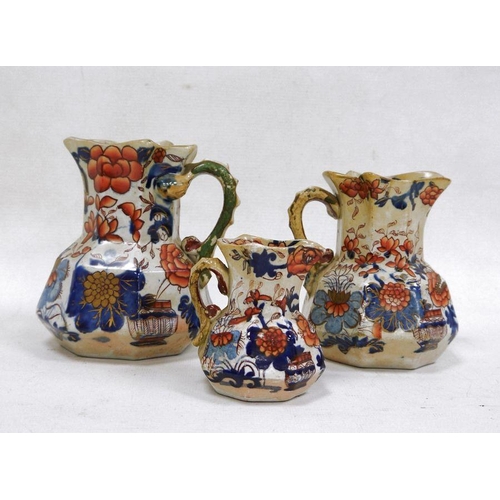 17 - Three Masons ironstone hydra jugs in sizes, 19th century, printed blue marks, printed and painted in... 