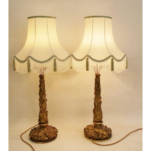 179 - Pair of cast gilt metal table lamps with naturalistic leaf decoration to column and base, approx 49c... 