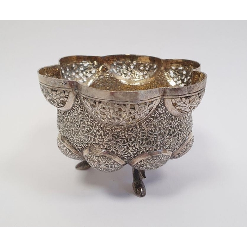 319 - Indian/Burmese white metal lobed bowl with pierced and engraved decoration, raised on three fish-sha... 