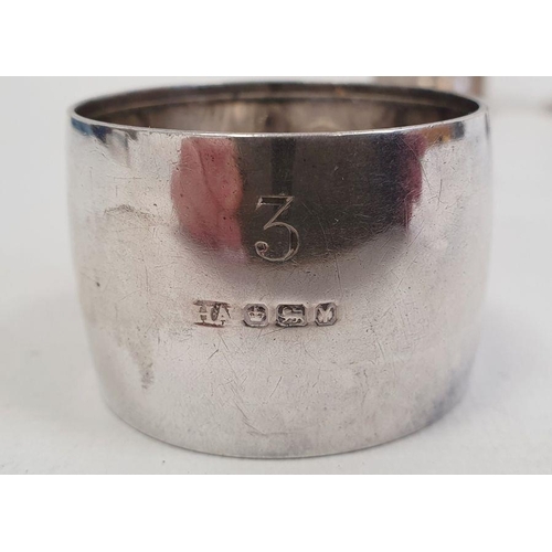 328 - Sterling silver child's cup, monogram engraved and footed, 2ozt approx. and three various silver nap... 