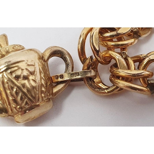 331 - Rolled gold charm bracelet of double flattened-oval links and hung with 9ct gold charm of rococo man... 